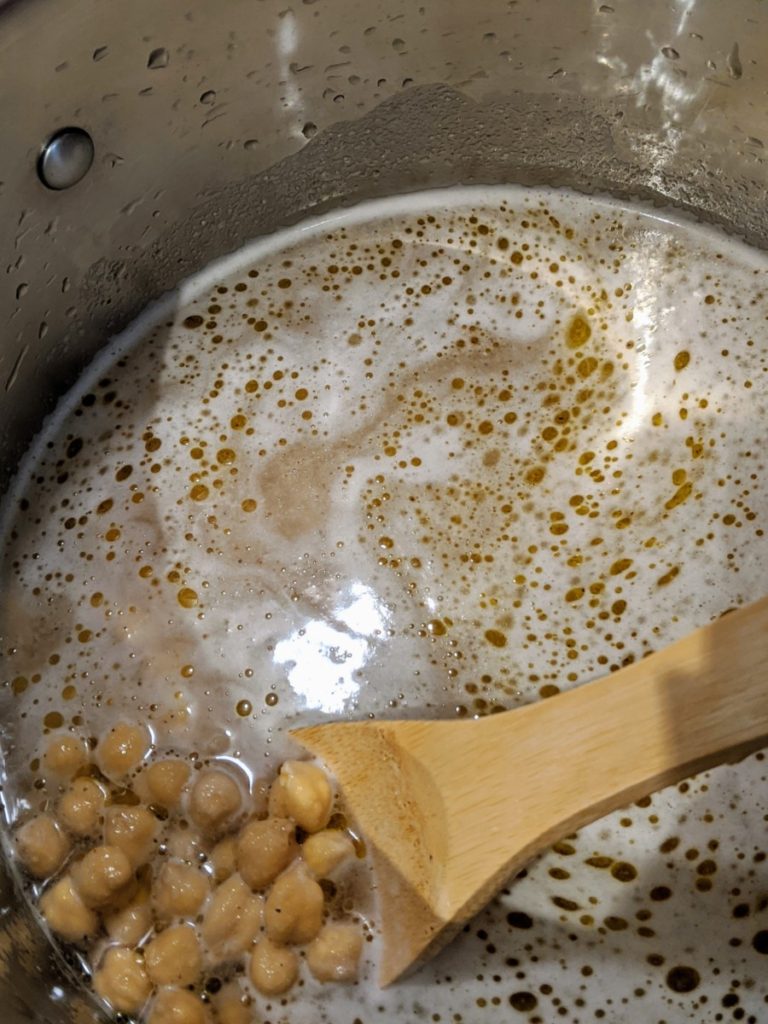 Garbanzo beans, early in the cooking process