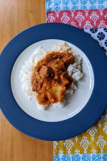 Carne con papas over rice