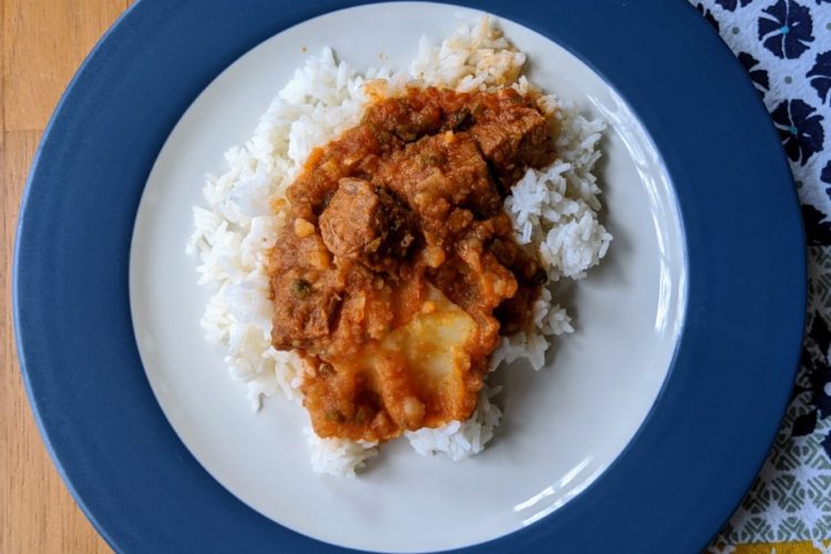 Carne con papas over rice