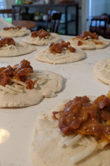 Pupusas being filled