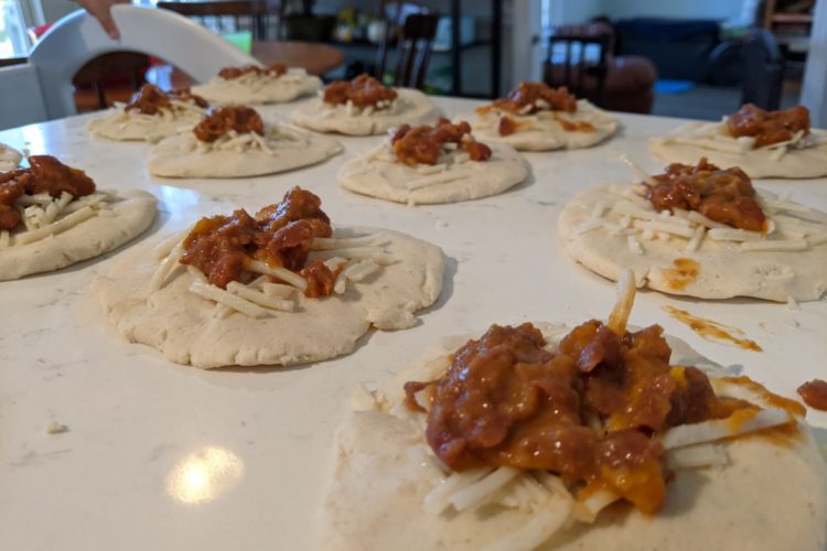 Pupusas being filled