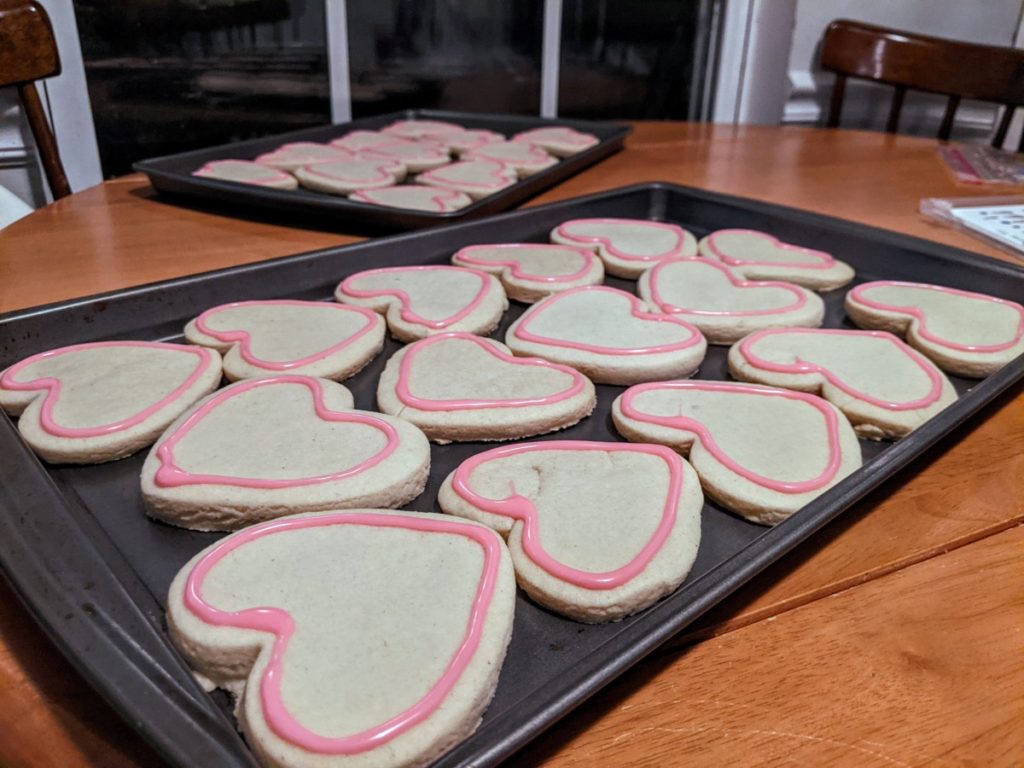 heart-shaped sugar cookies with outline icing