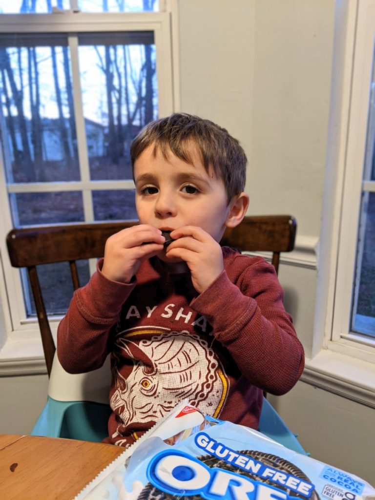 Boy eating gluten-free Oreo