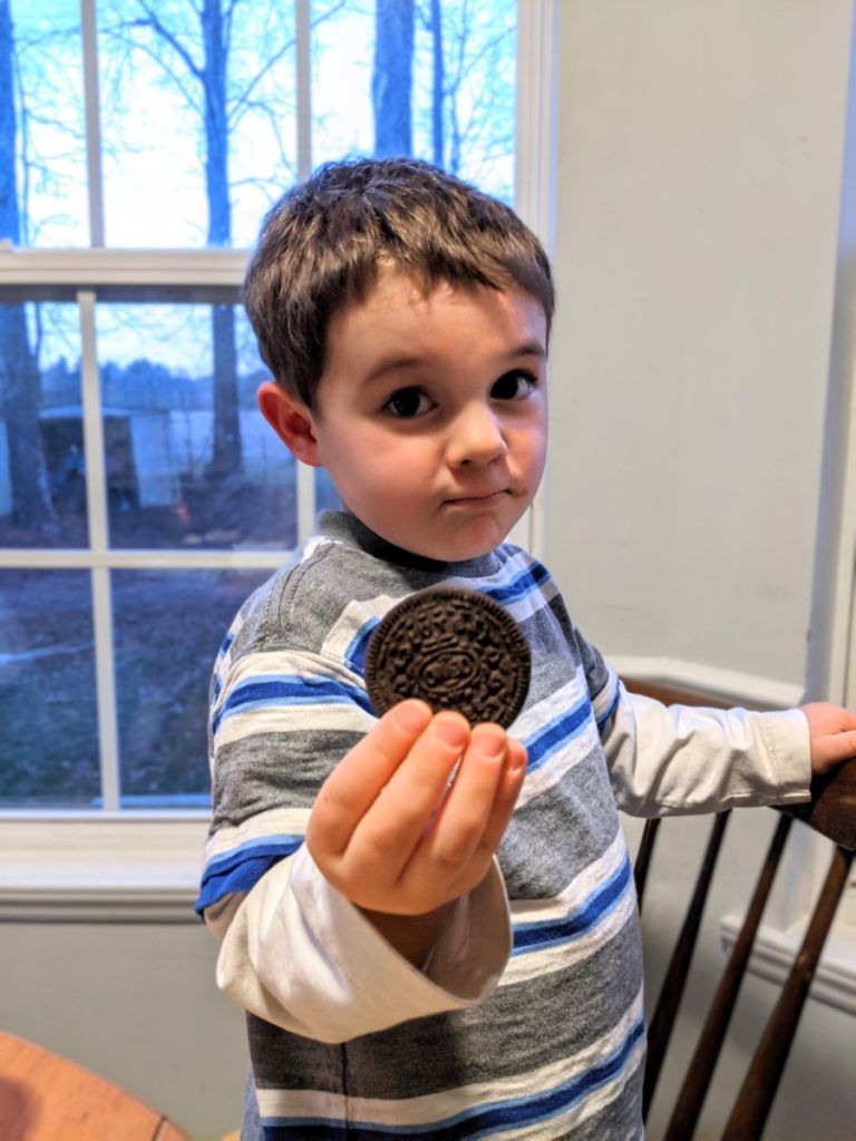 Boy eating gluten-free Oreo