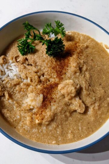 Chicken soup in a bowl over rice