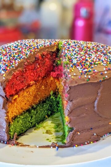 "Rainbow Cookie" cake with a slice cut out