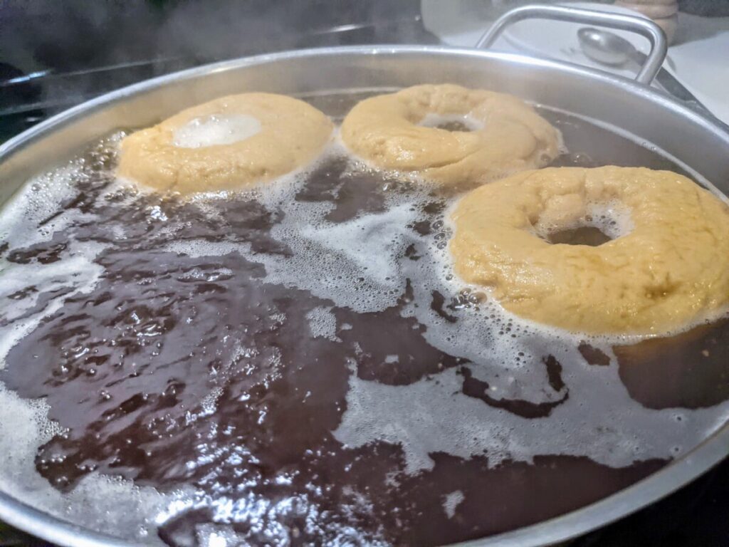 3 gluten-free bagels boiling