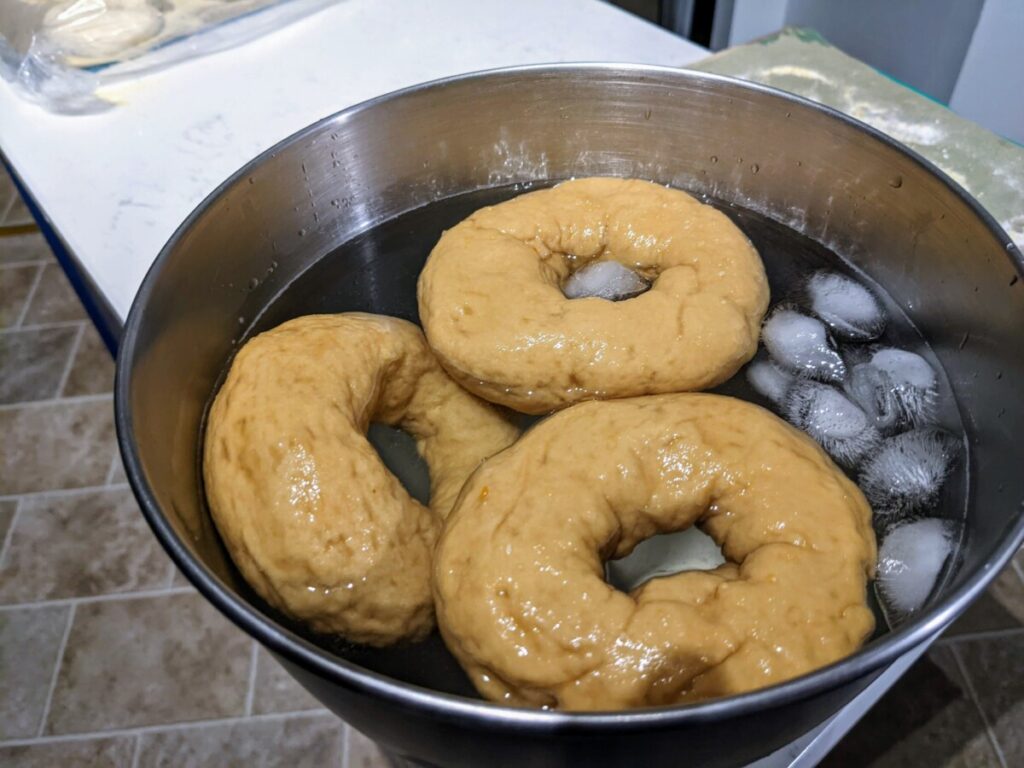 3 gluten-free bagels in ice water bath