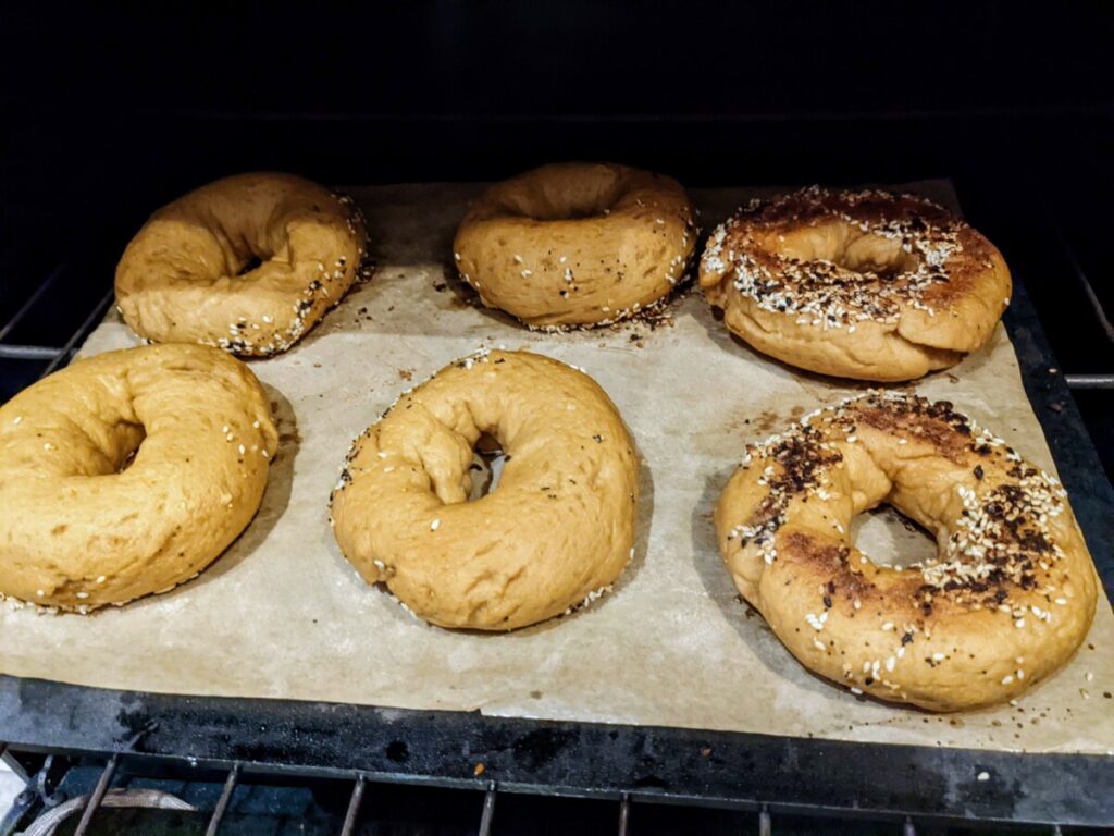 6 gluten-free bagels in the oven, after flip
